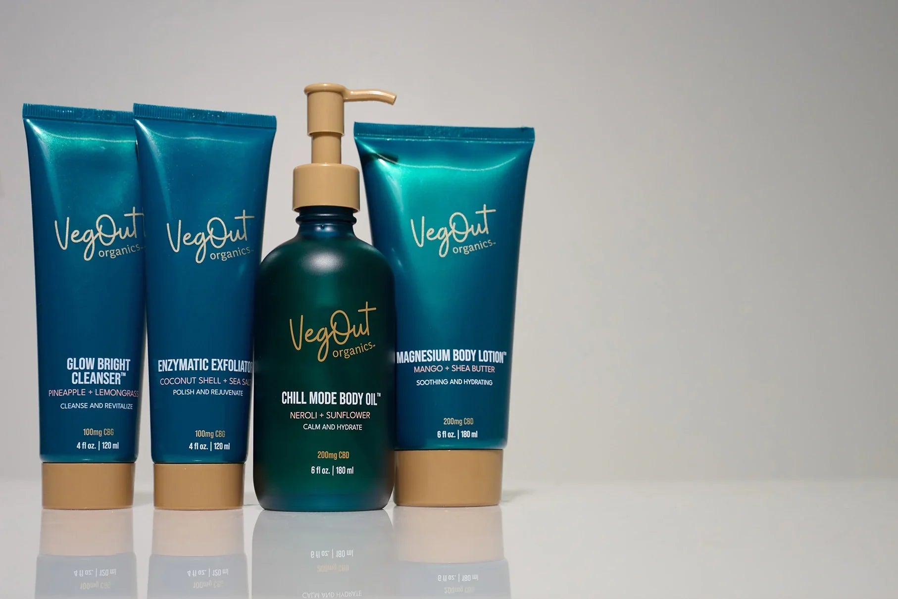 Top 4 Favorites Bundle by Veg Out Organics, featuring Glow Bright Cleanser, Enzymatic Exfoliator, Chill Mode Body Oil, and Magnesium Body Lotion — a complete vegan skincare routine.