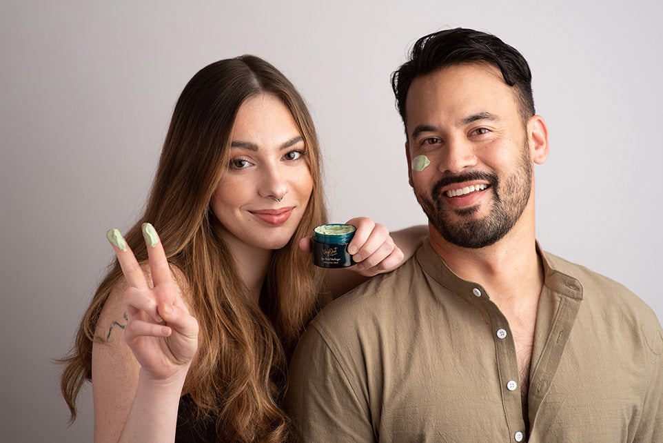 Smiling couple applying organic skincare cream – natural and vegan beauty routine.