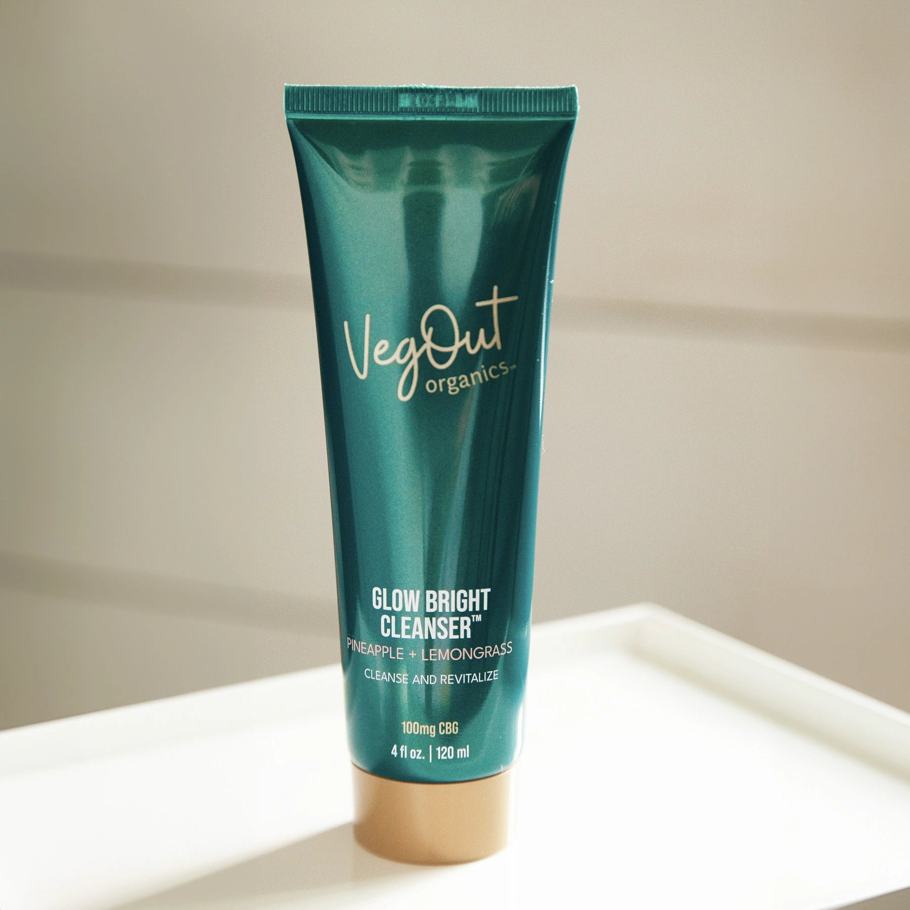 VegOut Organics Glow Bright Cleanser with Pineapple and Lemongrass, a natural facial cleanser designed to cleanse, revitalize, and brighten skin. Formulated with plant-based ingredients for a refreshing and nourishing skincare routine.